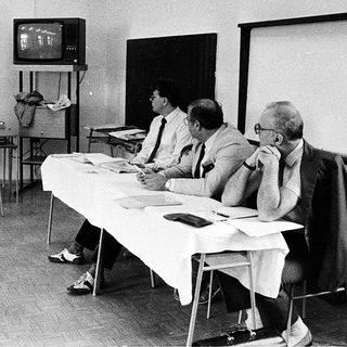 Business meeting with early computer demonstration.
