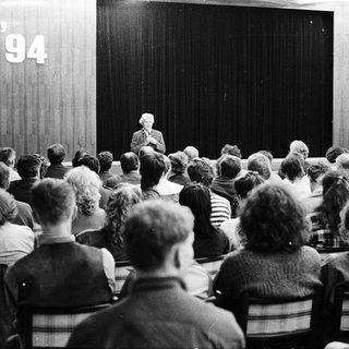 People attending a lecture or meeting in 1994.