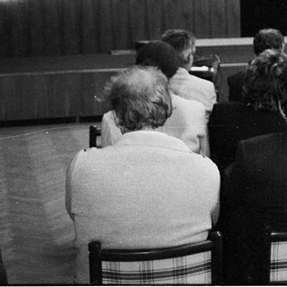 Speaker addressing audience at 1994 SOC event.