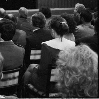 Speaker addressing audience at 1994 SOC event.