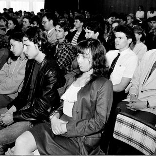 Audience attending a formal indoor event.