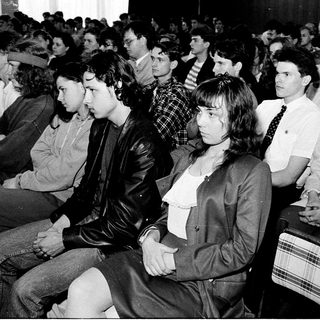 Audience attending a formal indoor event.