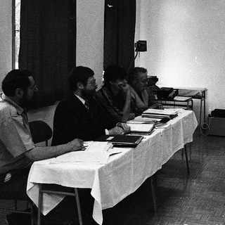 Business meeting with presentation in progress.