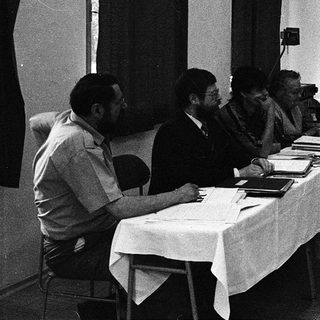 Business meeting with presentation in progress.