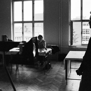 Classroom scene with students seated at desks.