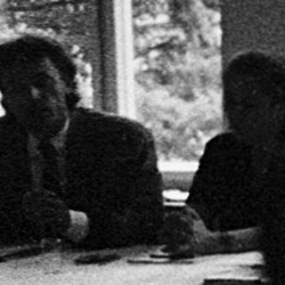 Classroom scene with students seated at desks.