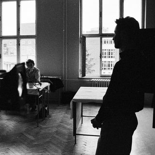 Classroom scene with students seated at desks.