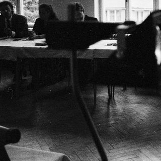 Classroom scene with students seated at desks.
