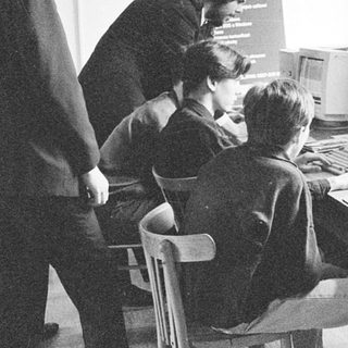 Classroom with students using early desktop computers.