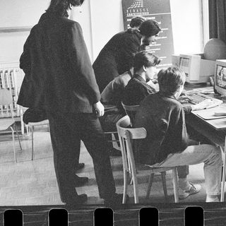Classroom with students using early desktop computers.