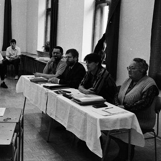 Classroom setting with early computer demonstration.