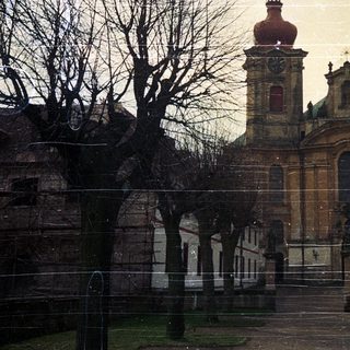 Baroque church with twin towers, winter scene.