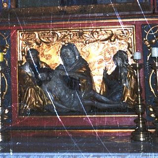 Elaborate religious shrine with gilded statues and intricate carvings.