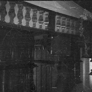Dark interior with marble floor reflections.