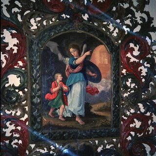 Angel presenting child to divine light.