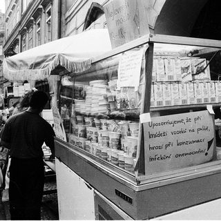 Street market stall warning about food poisoning risks.
