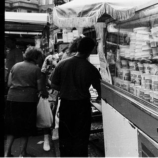Street market stall warning about food poisoning risks.