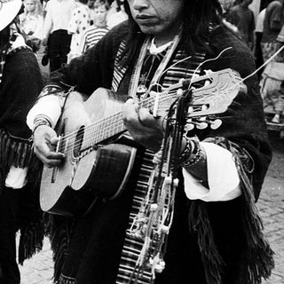 Traditional musicians performing outdoors in cultural attire.