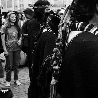 Indigenous cultural performance in urban protest setting.