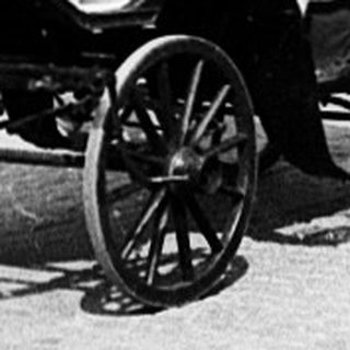 Historic astronomical clock with horse-drawn carriage.