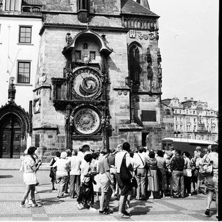 Historic Prague town square with medieval astronomical clock.