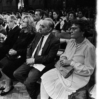 People attending a formal indoor event or ceremony.