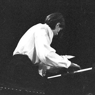 Pianist performing on stage at Petrograd Hall.