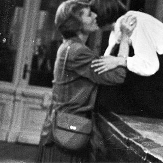 Two people embracing during an emotional indoor scene.