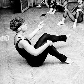 Group fitness class in gym studio.