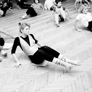 Group dance or movement class in progress.
