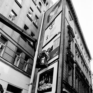 Vintage urban building with large posters.
