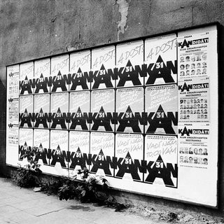 Election campaign posters for candidate "Anatoli Kankov" displayed.