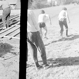 Construction workers laying railway tracks.