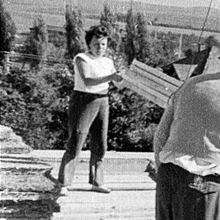 Manual construction of concrete slabs outdoors.