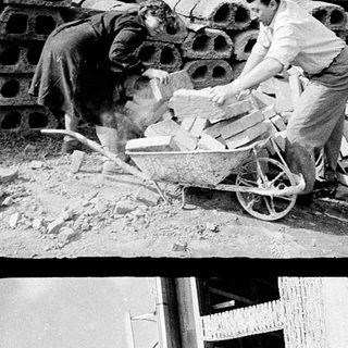 Construction workers handling bricks and materials on-site.