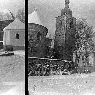 Historic church buildings covered in snow.