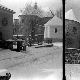 Historic church buildings covered in snow.