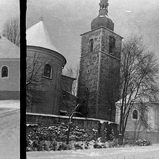 Historic church buildings covered in snow.
