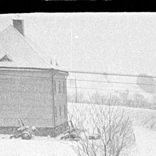 Snow-covered landscape with heavy accumulation.
