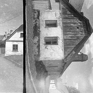 Vintage street view of old, weathered buildings.