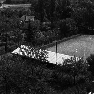 Aerial views of rural buildings and landscape before and after development.