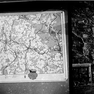 Historic map and ancient stone archway.