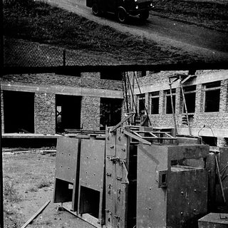 War-damaged buildings and military vehicles.