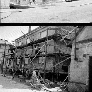 Historic street scene with building renovation.