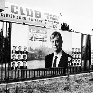 Political campaign posters near a club.