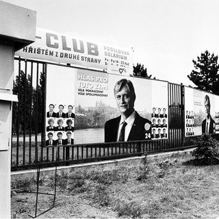 Political campaign posters near a club.