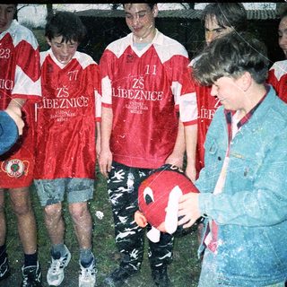 Group celebrating with soccer ball.