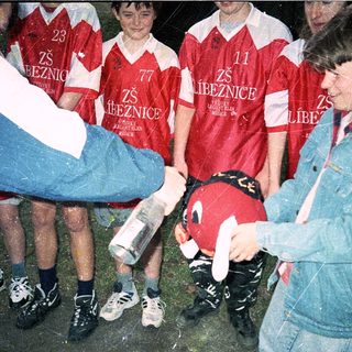Young soccer team receiving trophy or award.