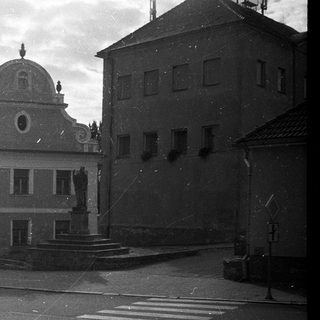 Historic European town square with old buildings.