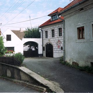 Quaint village street with historic stone buildings.